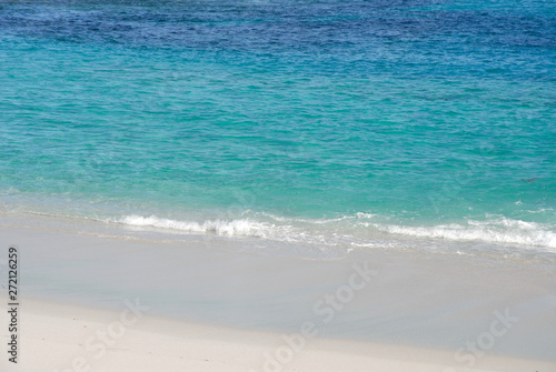 waves on the white sandy beach © Josie Elias