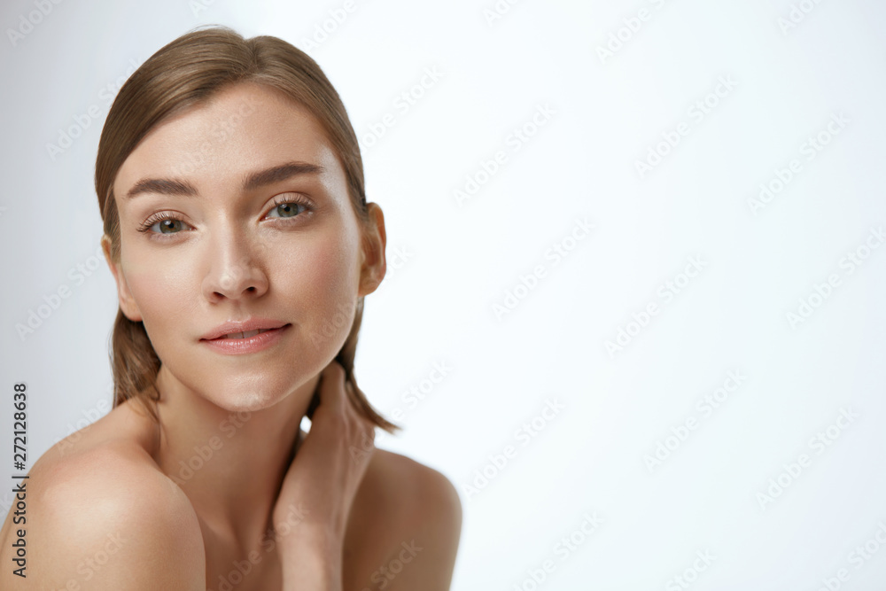 Beauty face. Woman model with healthy natural skin on white Beauty face. Woman model with healthy natural skin on white