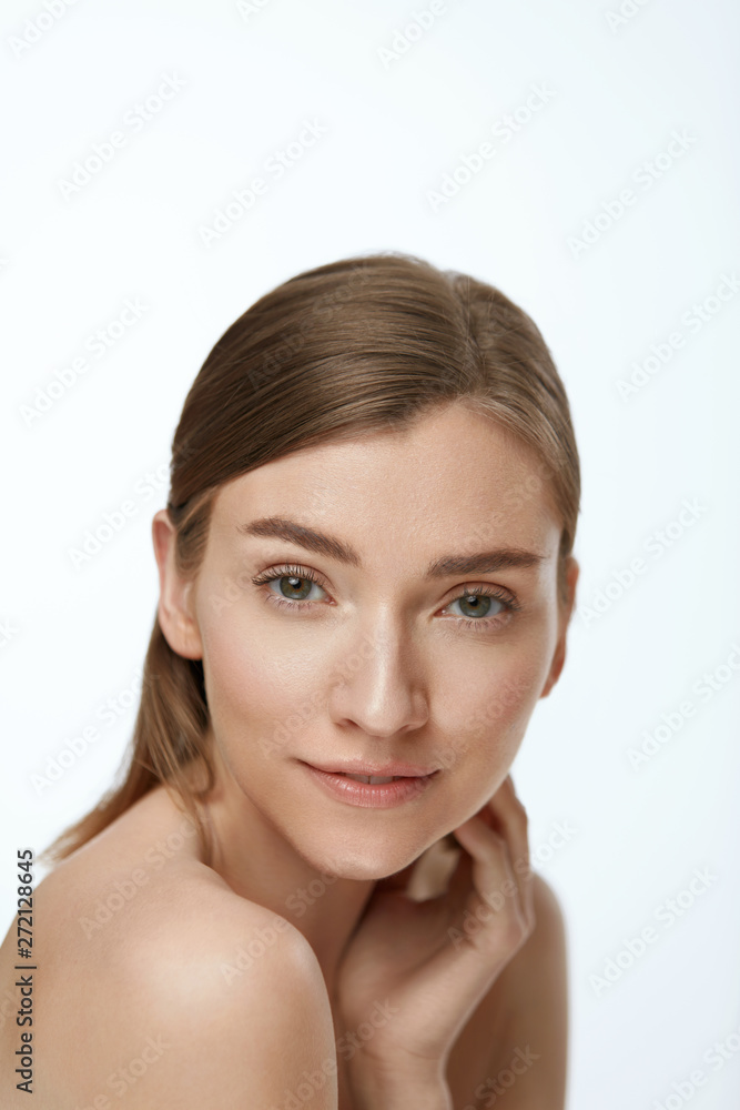 Beauty face. Woman model with healthy natural skin on white Beauty face. Woman model with healthy natural skin on white