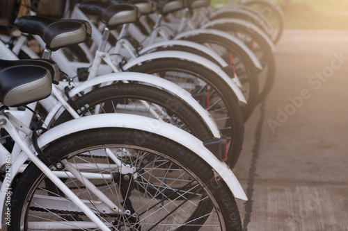 A rental bicycles stand on a parking at thailand