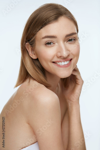 Beauty. Woman model with fresh skin and white smile portrait