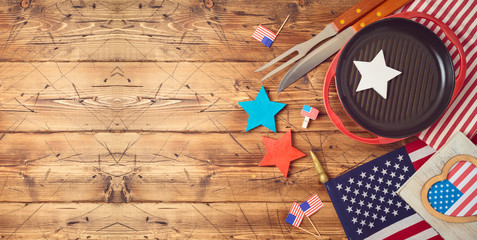 Happy Independence Day, 4th of July celebration concept with USA flag and barbeque grill  on wooden background.