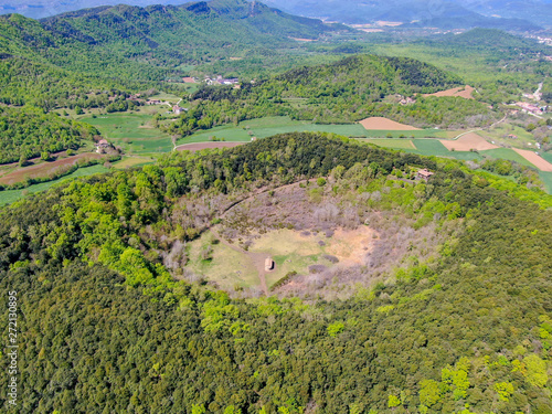 The Santa Margarida Volcano is an extinct volcano in the comarca of Garrotxa, Catalonia, Spain. The volcano has a perimeter of 2 km and a height of 682 meters in Garrotxa Volcanic Zone Natural Park photo