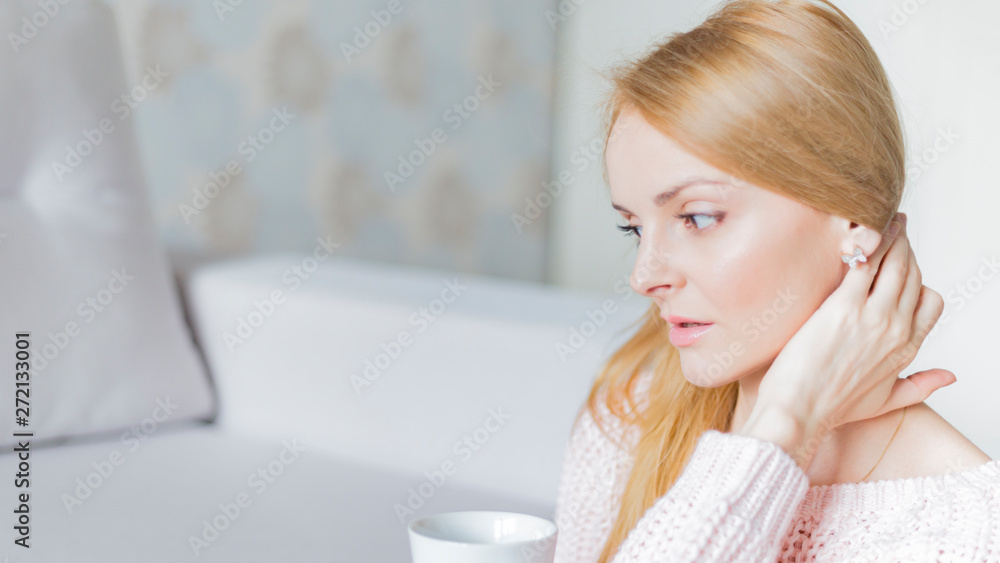 portrait of a woman sitting on sofa at home portrait of a woman sitting on sofa at home