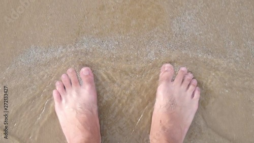 waves washing man feet, 4k