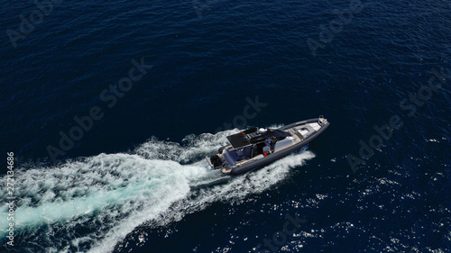 Aerial top view luxury inflatable rib speed boat cruising in Aegean deep blue open sea © aerial-drone