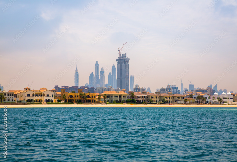 Fototapeta premium Dubai Marina skyscrapers and villas on the Palm Jumeirah. Luxury properties of UAE