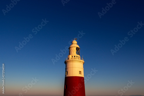 Exterior partial view of Europa Point Lighthouse, Trinity Lighthouse at Europa Point or Victoria Tower in Gibraltar at sunset
