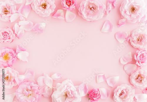 Flowers composition background. beautiful pale pink roses on pale pink    background.Top view.Copy space