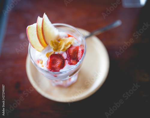 homemade fruit yoghurt with strawberry jam, apple and conflake photo