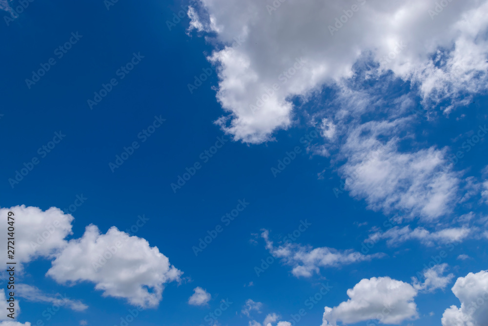 Fototapeta premium Fluffy White Clouds Floating in a Beautiful Blue Sky 05