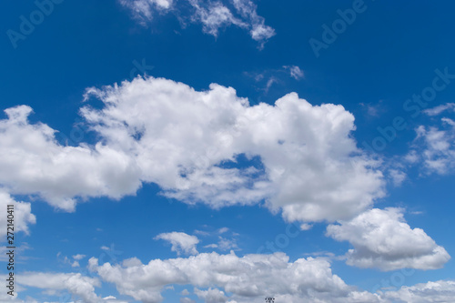 Fototapeta Naklejka Na Ścianę i Meble -  Fluffy White Clouds Floating in a Beautiful Blue Sky 02
