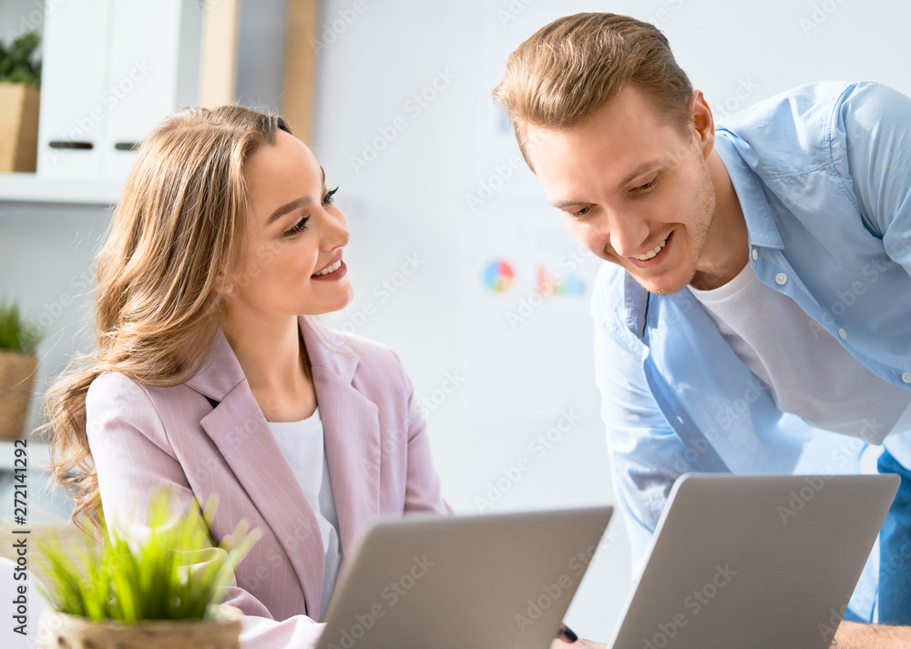 man and woman working in the office man and woman working in the office