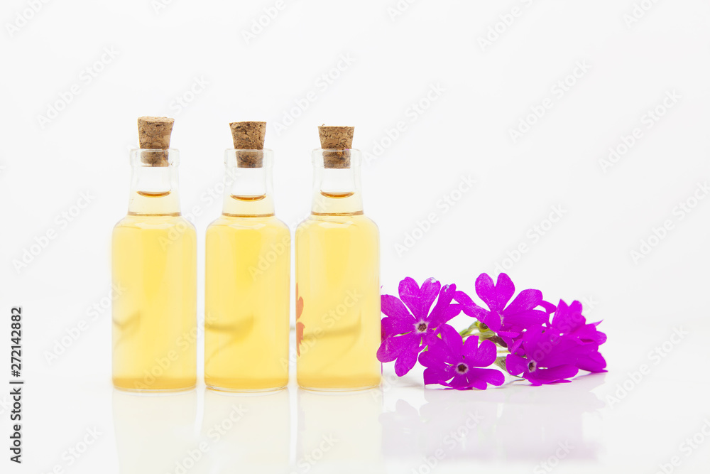 primrose essential oil in beautiful bottle on table primrose essential oil in beautiful bottle on table