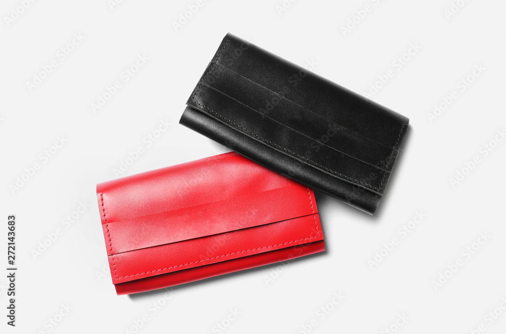 Stylish leather wallets on white background, top view Stylish leather wallets on white background, top view