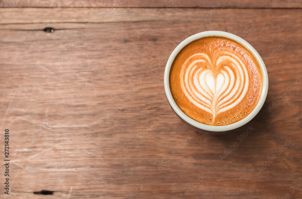 Close up of cappuccino with heart shape latte art Close up of cappuccino with heart shape latte art