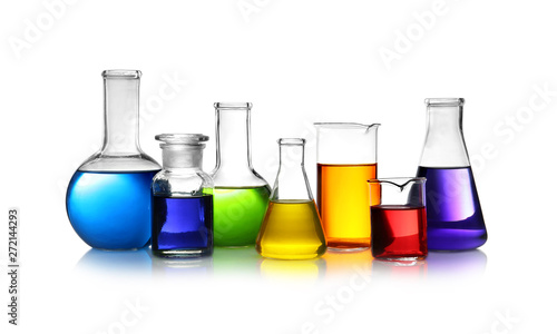 Set of different lab glassware with color liquid isolated on white