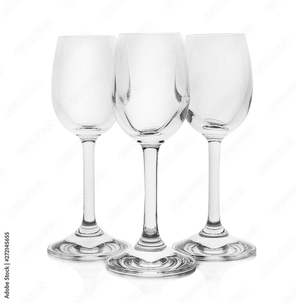 Empty clear glasses for liquor on white background Empty clear glasses for liquor on white background