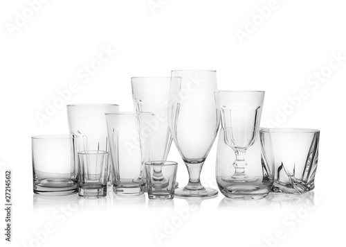 Set of empty glasses for different drinks on white background