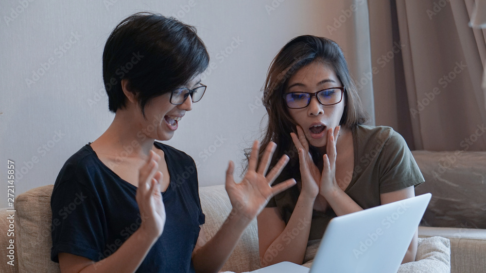 Mixed race Asian girls using computer for start up business Mixed race Asian girls using computer for start up business