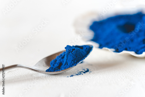 Blue Spirulina algae powder, healthy dietary supplement.