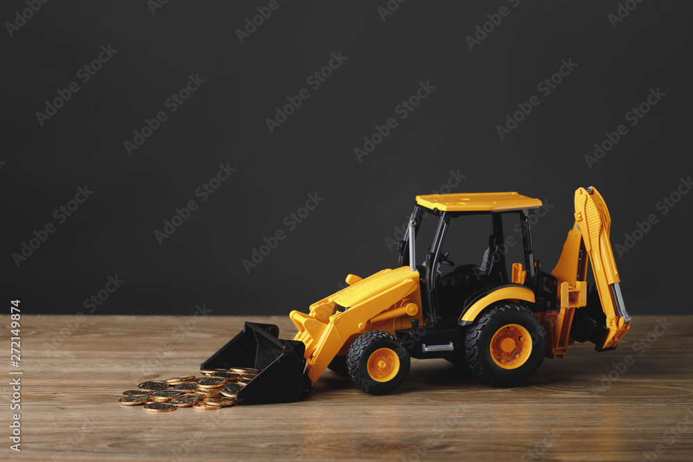backhoe tractor rake up money coins Stock Photo Adobe Stock