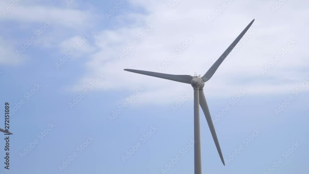 Car POV of windmills turning around in slow motion 180fps Car POV of windmills turning around in slow motion 180fps