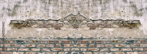Panorama old damaged brick wall with shabby plaster.