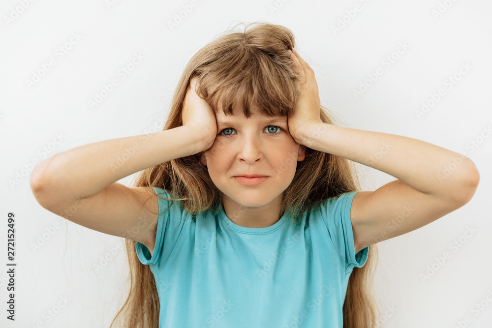 Frustrated and stress emotion. Portrait of 9 year girl against white background Frustrated and stress emotion. Portrait of 9 year girl against white background