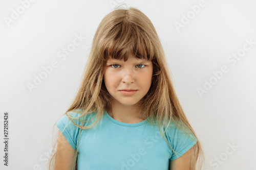 Furious, Frustrated and stress emotion. Portrait of 9 year girl against white background