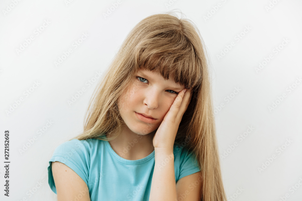 Tired,bored and exhausted emotion 9 year girl portrait against white background Tired,bored and exhausted emotion 9 year girl portrait against white background