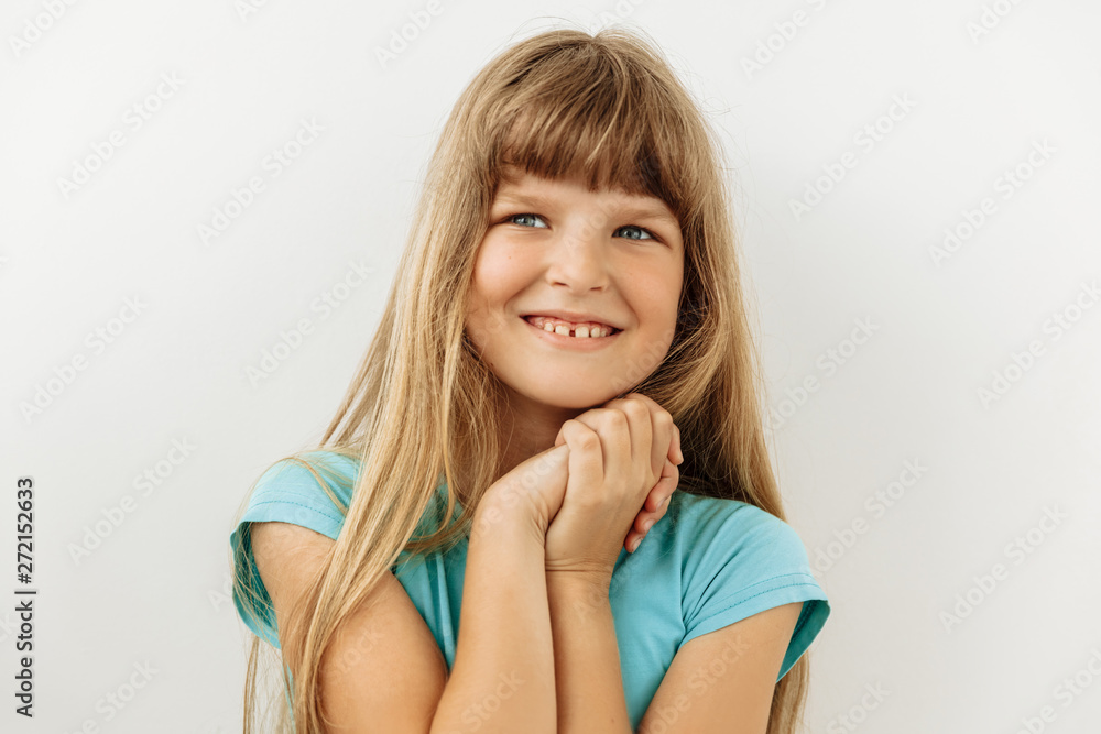Dreamy,pleased, thinking emotion . Wish concept. 9 year girl face portrait on white backgound. Dreamy,pleased, thinking emotion . Wish concept. 9 year girl face portrait on white backgound.