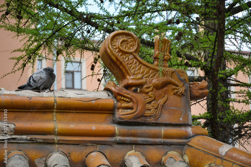 Dove on the roof of the Chinese-style pergola