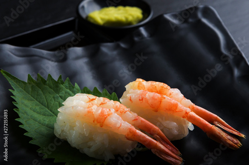 Creative Japanese food.IBotan Ebi Sushi on black background