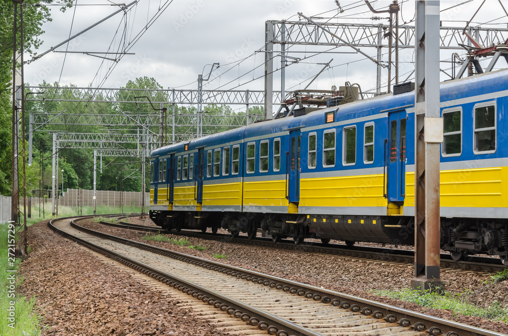 PASSENGER TRAIN - An electric vehicle on a modern railway route PASSENGER TRAIN - An electric vehicle on a modern railway route