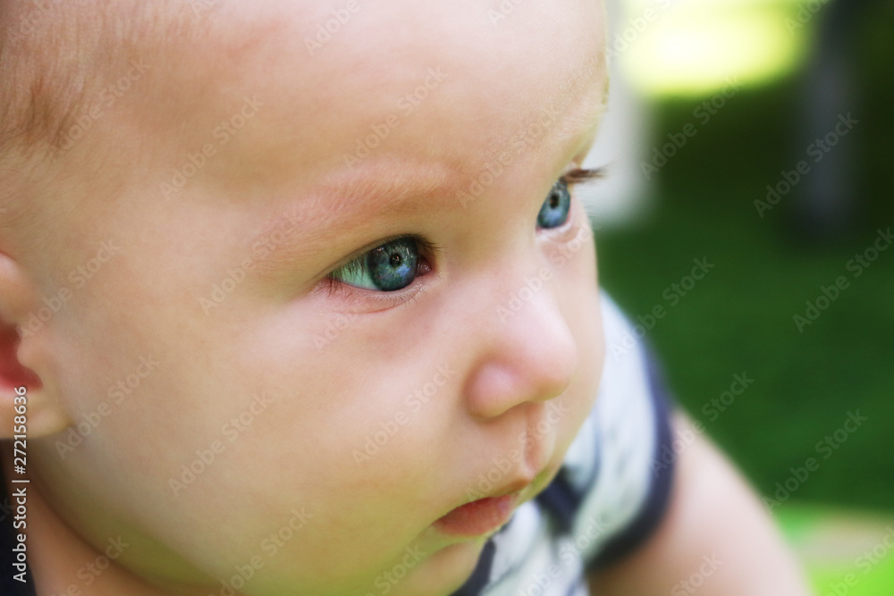 A small child with a surprised and curious look A small child with a surprised and curious look