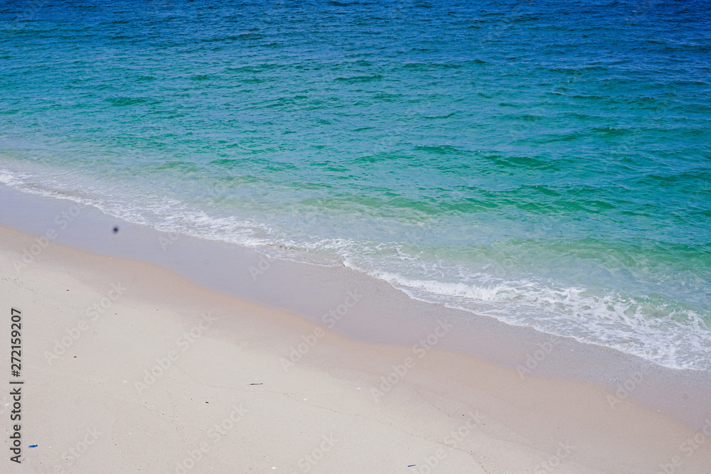 Beach, sand and ocean waves and blue sky in the morning, Phan Thiet beach vacation in Vietnam