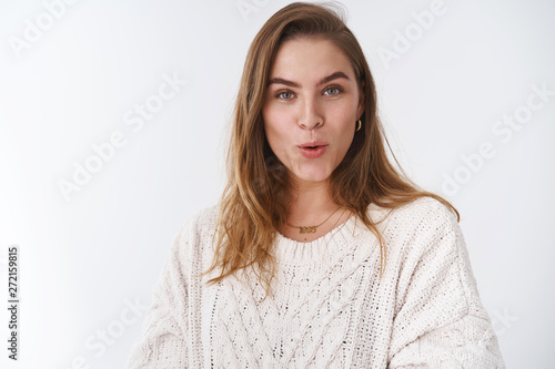 Girl hearing juicy interesting intriguing news girlfriend sharing curious secrets, folding lips amused giggling smiling pleased wanna hear details standing enthusiastic delighted white background