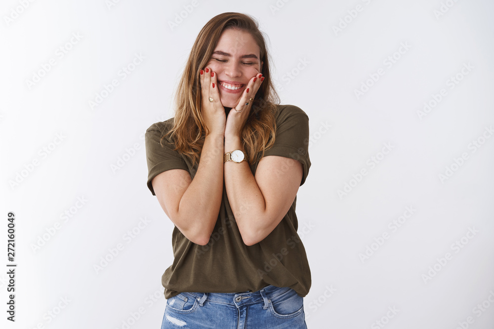 Happy good-looking positive sincere young european woman chestnut hair olive t-shirt squeez cheeks joyfilly close eyes smiling broadly white teeth grin, standing amused excited white background Happy good-looking positive sincere young european woman chestnut hair olive t-shirt squeez cheeks joyfilly close eyes smiling broadly white teeth grin, standing amused excited white background