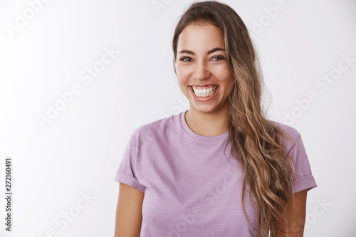 Charismatic carefree attractive healthy woman laughing out loud smiling white teeth giggling having fun, enjoying awesome friendly company watching comedy, chuckling funny joke, white background © Cookie Studio