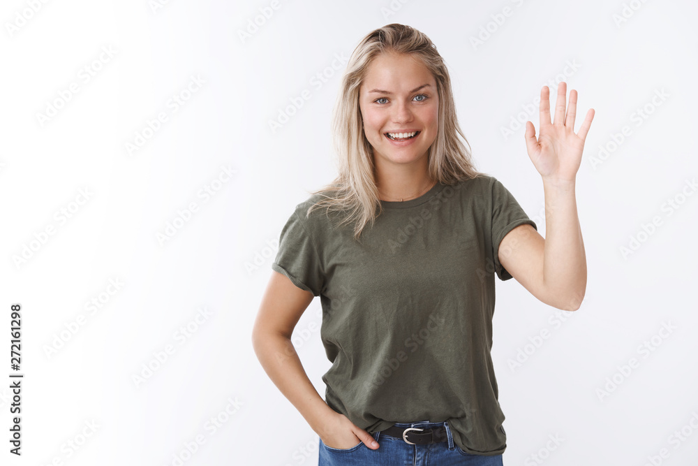 Hello nice to meet you. Portrait of friendly-looking charming outgoing female coworker with blond hair raise palm and wave in greeting smiling pleasant, welcoming guests to seminar saying hi Hello nice to meet you. Portrait of friendly-looking charming outgoing female coworker with blond hair raise palm and wave in greeting smiling pleasant, welcoming guests to seminar saying hi