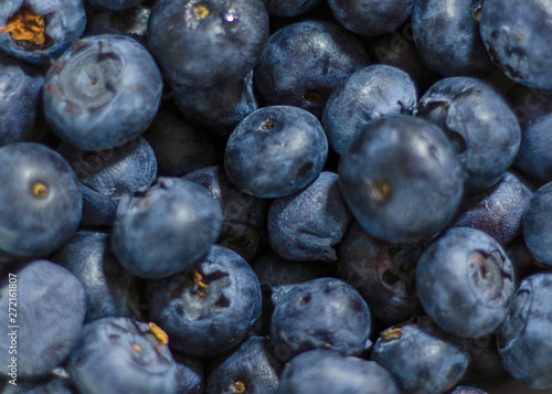 Blueberrys from above agaisnt a wood background