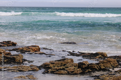 Blue Ocean waves over rocks