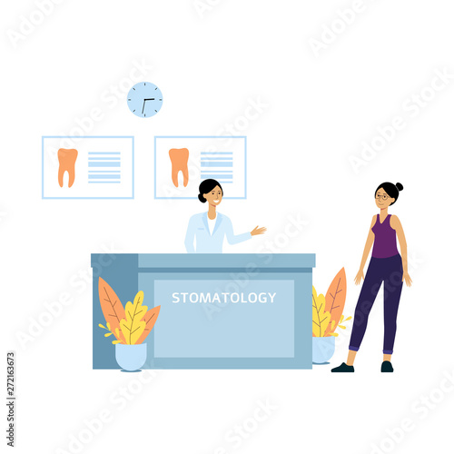 Female patient at dentist clinic reception desk. Friendly receptionist welcomes client to doctor's dental office