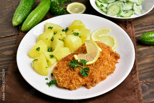 Schnitzel with boiled potato photo