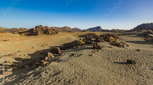 Volcanic landscape of Tenerife with dry lava rocks in foreground. Canary Islands  Spain. Teide National Park.