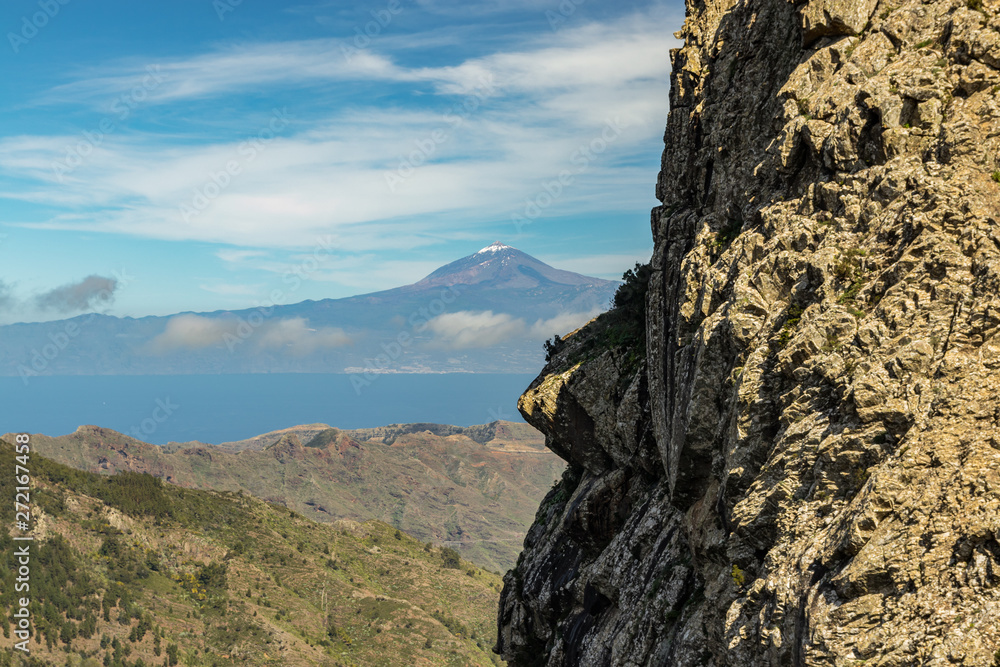 Snowy peak of volcano Teide, Tenerife. View from the Island La Gomera, Los Roques rocks. Snowy peak of volcano Teide, Tenerife. View from the Island La Gomera, Los Roques rocks.