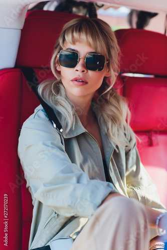 Female pilot in cockpit of helicopter before take off. Young woman helicopter pilot. photo