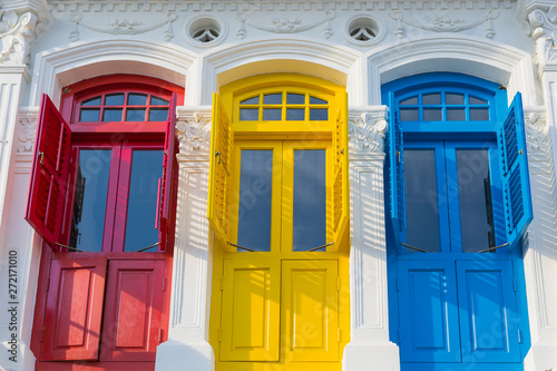 Colonial style three colorored doors with ornaments