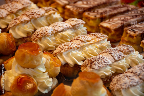 Photography Freshly baked stuffed sweet pastries Orange Lactee and Dome Citron with fruits i